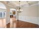 Dining room featuring a decorative chandelier, modern trim, and gorgeous archway at 5232 Centennial Hill Nw Dr, Acworth, GA 30102