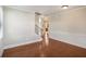 Bright living room featuring wood floors, crown molding, and modern wainscotting at 5232 Centennial Hill Nw Dr, Acworth, GA 30102