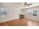 Bright living room features hardwood floors, a cozy fireplace, and plenty of natural light at 5232 Centennial Hill Nw Dr, Acworth, GA 30102