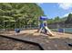 Community playground includes slides, swings, and climbing structures for enjoyment at 5232 Centennial Hill Nw Dr, Acworth, GA 30102