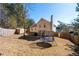 Spacious fenced backyard with mature trees, shed, patio, and trampoline at 2860 River Close Dr, Decatur, GA 30034