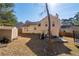 Backyard showcasing a patio, grill, storage shed, and lush greenery at 2860 River Close Dr, Decatur, GA 30034