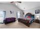 Spacious main bedroom with a vaulted ceiling, a purple sofa, and natural light at 2860 River Close Dr, Decatur, GA 30034