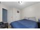 Bedroom featuring a bed with blue comforter and a window with dark blue curtains at 2860 River Close Dr, Decatur, GA 30034