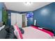 Bedroom highlighting the bed, wall-mounted TV, and ample closet space for storage at 2860 River Close Dr, Decatur, GA 30034