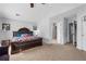 Large bedroom featuring a king-size bed, vaulted ceiling, and multiple doorways at 2860 River Close Dr, Decatur, GA 30034