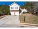 Charming two-story home with a brick facade, two-car garage, and landscaped front yard at 2860 River Close Dr, Decatur, GA 30034