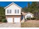Charming two-story home featuring a two-car garage and manicured front lawn at 2860 River Close Dr, Decatur, GA 30034