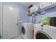 Functional laundry room with washer, dryer, storage shelves, and practical layout at 2860 River Close Dr, Decatur, GA 30034