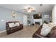 Comfortable living room featuring a fireplace, TV, and laminate flooring at 2860 River Close Dr, Decatur, GA 30034