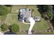 An aerial view shows the layout of the home, pool, firepit, and lush landscaping on the property at 2497 Sugar Pike Rd, Canton, GA 30115