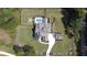 An aerial view shows a home, pool, and firepit area surrounded by a dark fence at 2497 Sugar Pike Rd, Canton, GA 30115
