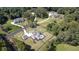 Aerial showcases two luxury homes nestled amongst lush greenery, each with private driveways and manicured lawns at 2497 Sugar Pike Rd, Canton, GA 30115