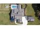 Overhead aerial photo of a house, detached garage, pool, and firepit area in a fenced backyard at 2497 Sugar Pike Rd, Canton, GA 30115