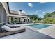 Beautiful backyard with a pristine pool, lounge chairs, and well-maintained landscaping, perfect for relaxation at 2497 Sugar Pike Rd, Canton, GA 30115
