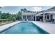 Stunning backyard with a refreshing pool, comfortable lounge area, and beautifully landscaped surroundings at 2497 Sugar Pike Rd, Canton, GA 30115