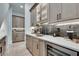 Chic bar area with light wood cabinetry, stone countertops, wine storage, and stainless beverage cooler at 2497 Sugar Pike Rd, Canton, GA 30115