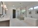 Serene bathroom featuring a soaking tub, glass shower, and double vanity with modern fixtures at 2497 Sugar Pike Rd, Canton, GA 30115