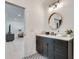 Modern bathroom featuring dark cabinets, a marble countertop, and modern mirror at 2497 Sugar Pike Rd, Canton, GA 30115