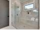 Modern bathroom featuring a glass shower with natural stone and built in bench and soaps at 2497 Sugar Pike Rd, Canton, GA 30115