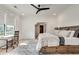 Bright bedroom featuring a bed with built-in storage, a desk, and a large window at 2497 Sugar Pike Rd, Canton, GA 30115