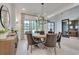 Inviting dining room featuring a chandelier, table with chairs, and a view of the adjacent home office at 2497 Sugar Pike Rd, Canton, GA 30115