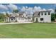An exterior view shows the home's facade and matching detached garage in a large manicured yard at 2497 Sugar Pike Rd, Canton, GA 30115