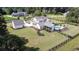 This home features a beautiful backyard with a pool, expansive lawn, and a detached garage, all enclosed by a black fence at 2497 Sugar Pike Rd, Canton, GA 30115