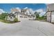 Spacious four car garage attached to the house featuring a concrete drive and modern farmhouse design at 2497 Sugar Pike Rd, Canton, GA 30115