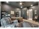 Well-appointed home office featuring a rustic wood desk, shelving, and comfortable seating with views at 2497 Sugar Pike Rd, Canton, GA 30115