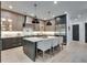 A modern kitchen with a large center island, stainless steel appliances, and a combination of cabinets and shelving at 2497 Sugar Pike Rd, Canton, GA 30115