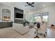 Bright living room featuring hardwood floors, a fireplace, and stylish furniture at 2497 Sugar Pike Rd, Canton, GA 30115