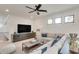 Bright living room with a large sectional sofa, flat screen tv, and modern decor at 2497 Sugar Pike Rd, Canton, GA 30115