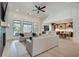 Open-concept living room featuring hardwood floors and an open floorplan to the kitchen and dining area at 2497 Sugar Pike Rd, Canton, GA 30115