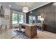 Office with a wooden desk, zebra rug, paneled wall, stylish lighting, and large windows at 2497 Sugar Pike Rd, Canton, GA 30115