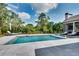 Stunning backyard featuring a modern swimming pool with sleek tile surround and comfortable lounge chairs at 2497 Sugar Pike Rd, Canton, GA 30115