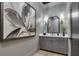 Contemporary powder room with gray vanity, quartz countertop, decorative lighting, and neutral wall color at 2497 Sugar Pike Rd, Canton, GA 30115