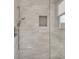 Modern shower featuring subway tile, a built-in niche, and glass enclosure at 2497 Sugar Pike Rd, Canton, GA 30115