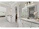 Bright bathroom with dual vanities, white cabinetry and a view into the walk-in shower at 336 Little Pine Ln, Woodstock, GA 30188