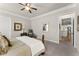 Spacious bedroom featuring a ceiling fan and view of the kitchen with stainless steel appliances at 336 Little Pine Ln, Woodstock, GA 30188