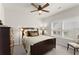 Cozy bedroom with a ceiling fan and large window providing ample natural light at 336 Little Pine Ln, Woodstock, GA 30188