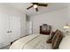 Comfortable bedroom featuring plush bedding, a ceiling fan, and double door closet at 336 Little Pine Ln, Woodstock, GA 30188