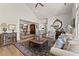 Comfortable living room showcasing hardwood floors and an open layout to the dining area at 336 Little Pine Ln, Woodstock, GA 30188