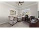 Comfortable home office featuring two chairs, a desk, and a bright window view at 336 Little Pine Ln, Woodstock, GA 30188