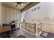 Covered back porch with ceiling fan, grill and outdoor seating at 336 Little Pine Ln, Woodstock, GA 30188