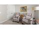 Relaxing sitting room featuring two comfortable chairs and ample natural light at 336 Little Pine Ln, Woodstock, GA 30188