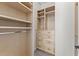 Organized walk-in closet with custom built-in shelves and drawers for ample storage at 336 Little Pine Ln, Woodstock, GA 30188