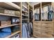 Spacious walk-in closet featuring custom shelving, drawers, and hanging storage solutions at 336 Little Pine Ln, Woodstock, GA 30188