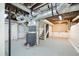 Unfinished basement with visible ducts, concrete floors, a doorway, and potential for customization at 3451 Keswick Ct, Atlanta, GA 30341