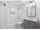 Bright bathroom features a shower and tub combination and a modern vanity at 3451 Keswick Ct, Atlanta, GA 30341